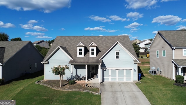 view of front of house with a front lawn and a garage