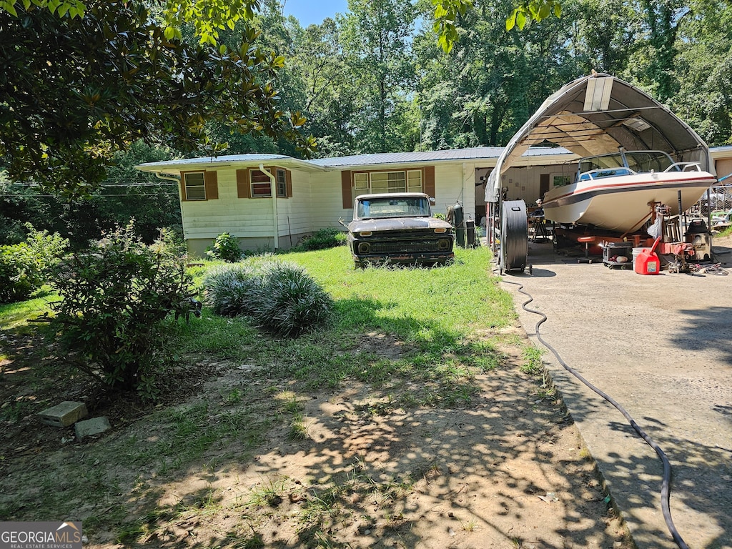 view of front of home with a carport