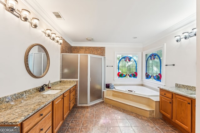 bathroom with vanity, crown molding, and independent shower and bath