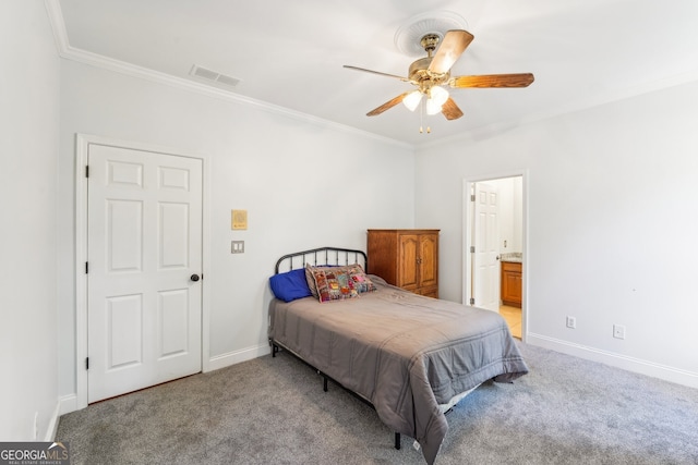 bedroom with crown molding, ensuite bathroom, light colored carpet, and ceiling fan