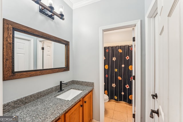 bathroom featuring vanity, toilet, crown molding, and tile patterned floors