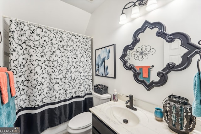 bathroom featuring vanity, a shower with shower curtain, and toilet