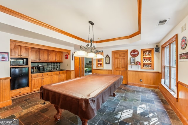 rec room featuring wooden walls, crown molding, a raised ceiling, and pool table