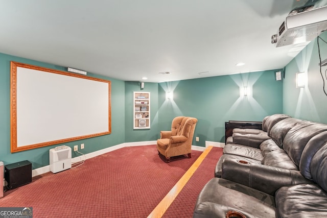 cinema room featuring carpet flooring