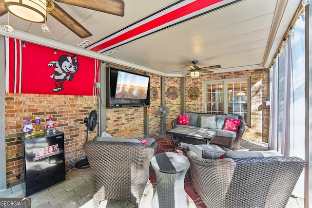 view of patio with ceiling fan and an outdoor living space