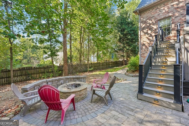 view of patio / terrace with a fire pit