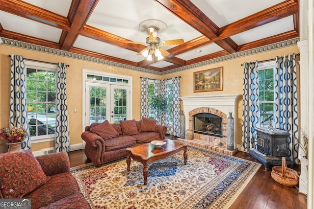 living room featuring beam ceiling, hardwood / wood-style flooring, and coffered ceiling