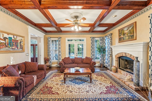 living room with french doors, beamed ceiling, coffered ceiling, and wood-type flooring