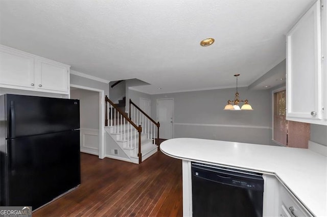 kitchen with black appliances, hanging light fixtures, white cabinets, a chandelier, and dark hardwood / wood-style floors