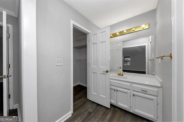 bathroom featuring vanity and hardwood / wood-style floors