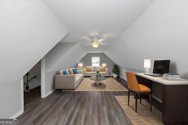 office space with dark wood-type flooring, vaulted ceiling, and ceiling fan