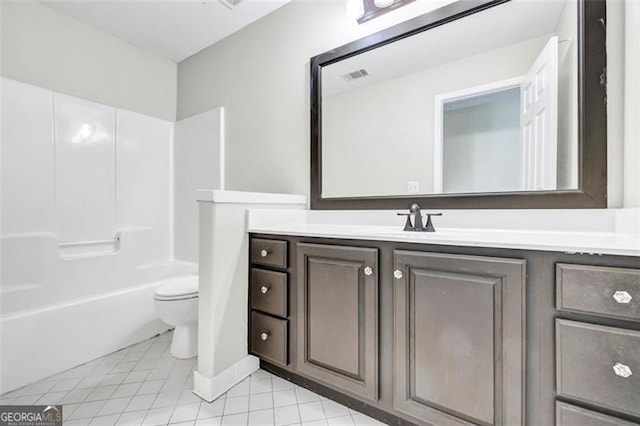 full bathroom featuring vanity, bathtub / shower combination, toilet, and tile patterned floors