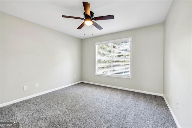 spare room with carpet and ceiling fan