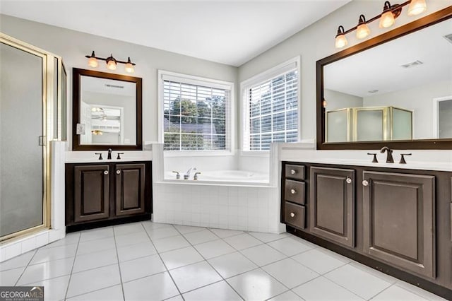 bathroom featuring vanity, independent shower and bath, and tile patterned flooring