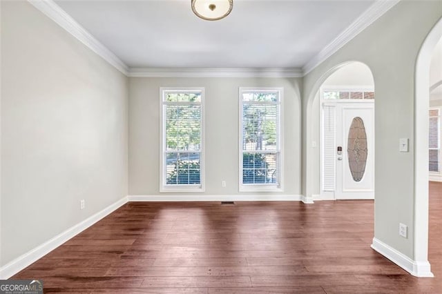 foyer featuring crown molding and dark hardwood / wood-style flooring