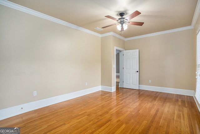 spare room featuring light hardwood / wood-style floors, crown molding, and ceiling fan