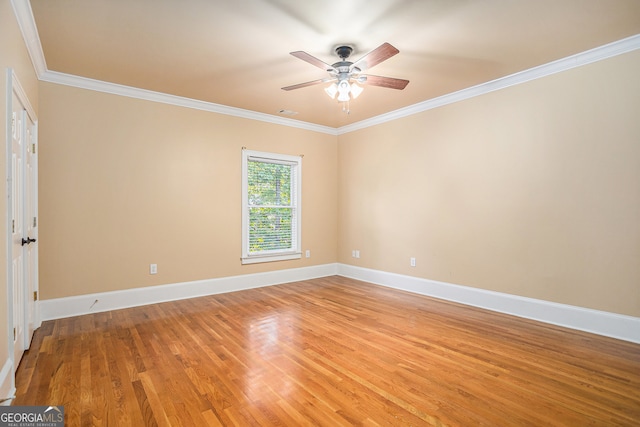 unfurnished room featuring light hardwood / wood-style floors, ornamental molding, and ceiling fan