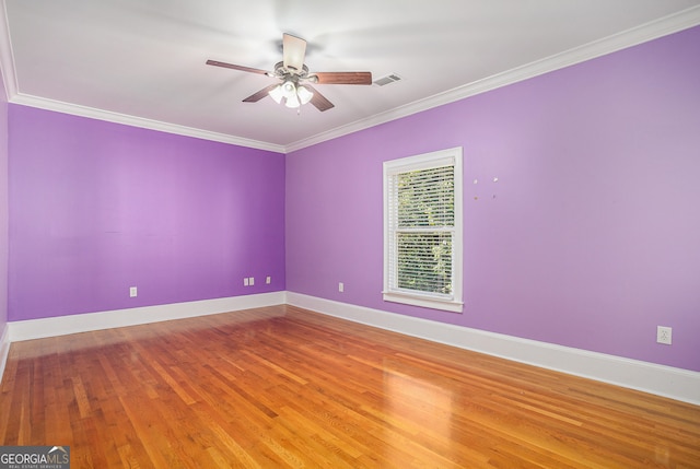 unfurnished room featuring ceiling fan, crown molding, and wood-type flooring