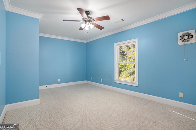 empty room with crown molding, carpet floors, and ceiling fan