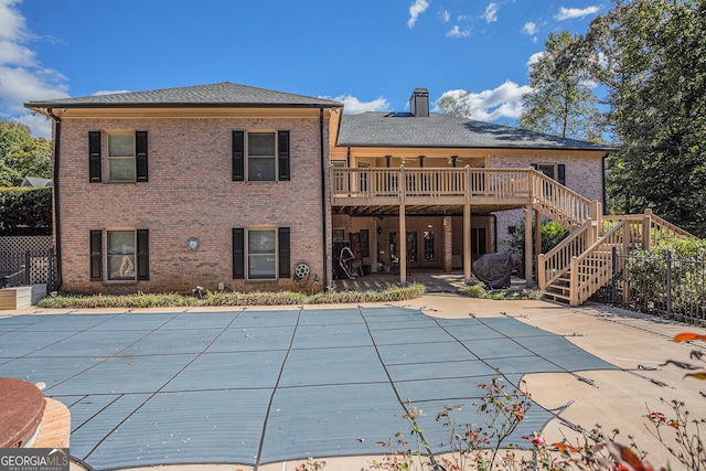 exterior space featuring a deck and a patio