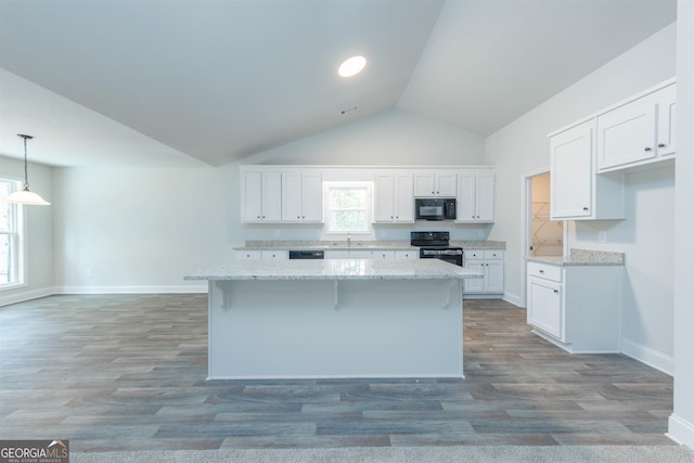 kitchen with black appliances, white cabinets, decorative light fixtures, and plenty of natural light