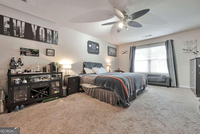 bedroom with ceiling fan and carpet floors