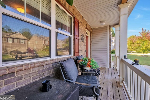 wooden terrace with a porch