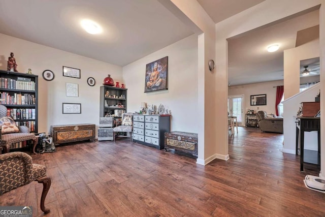 living area with hardwood / wood-style flooring