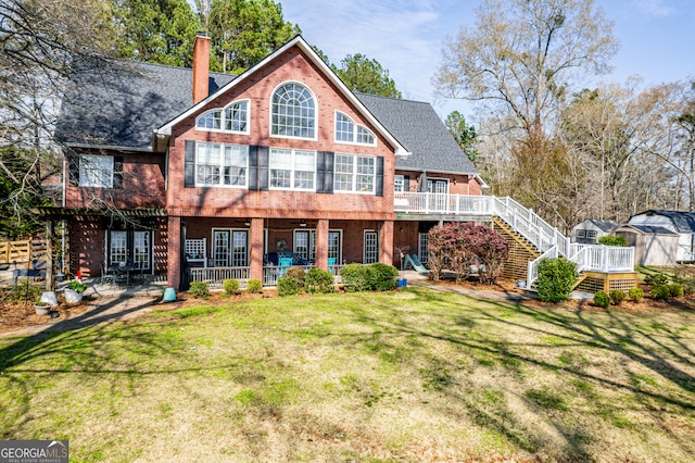 back of house with a yard