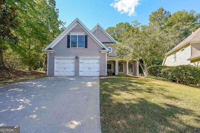 view of front of property featuring a garage and a front yard