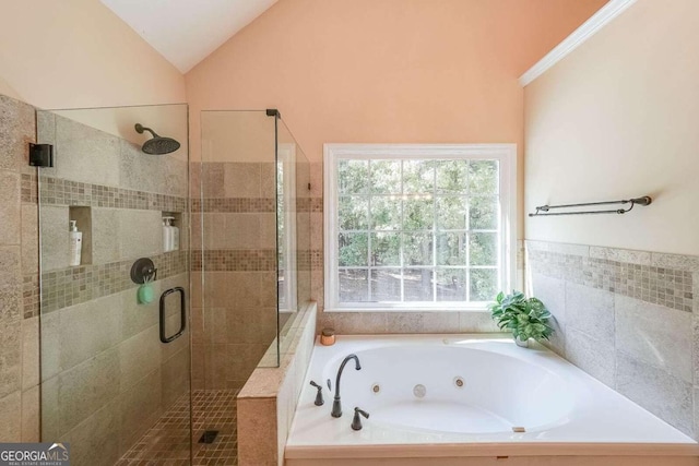 bathroom featuring plus walk in shower and vaulted ceiling