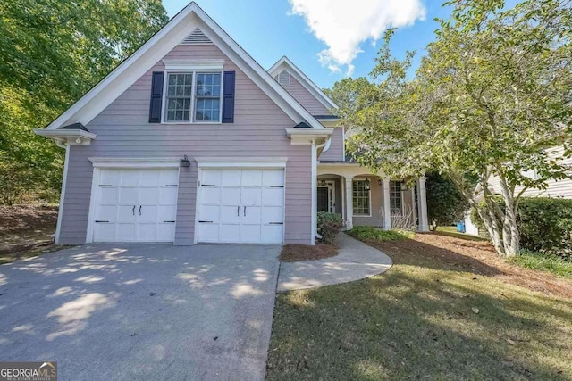 view of front facade featuring a garage and a front lawn