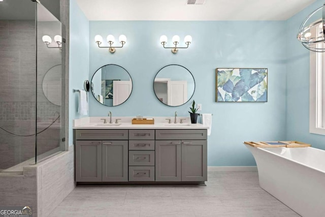 bathroom featuring vanity, separate shower and tub, and tile patterned floors