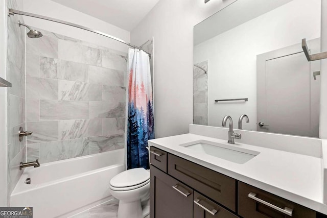 full bathroom with vanity, shower / bath combo with shower curtain, and toilet