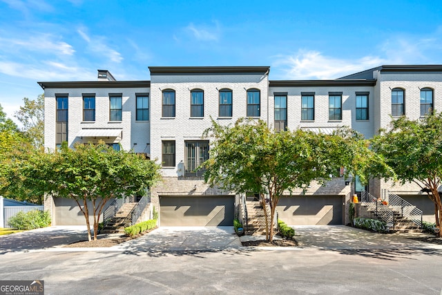 townhome / multi-family property featuring a garage