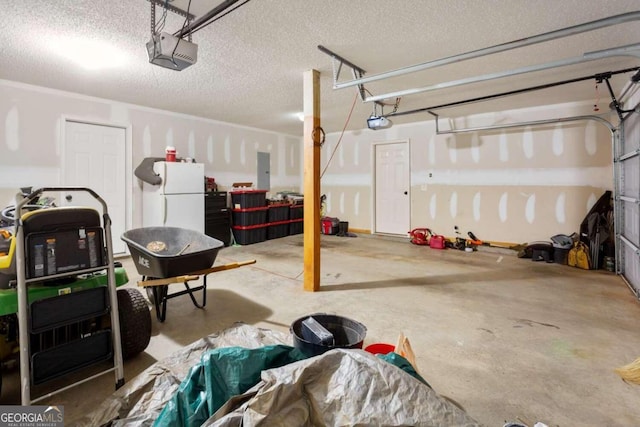 garage with electric panel, a garage door opener, and white fridge