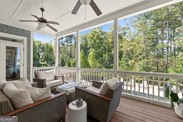 sunroom / solarium with ceiling fan and a wealth of natural light