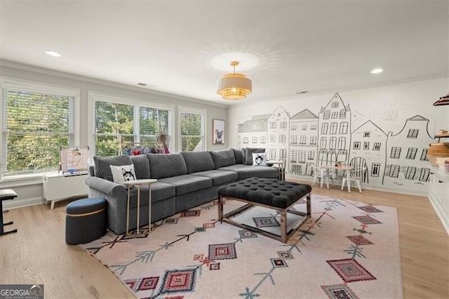 living room with ornamental molding and hardwood / wood-style floors