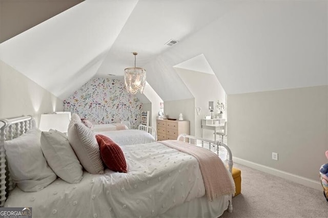 bedroom featuring a notable chandelier, vaulted ceiling, and light carpet