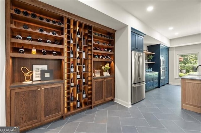 wine room with dark tile patterned flooring