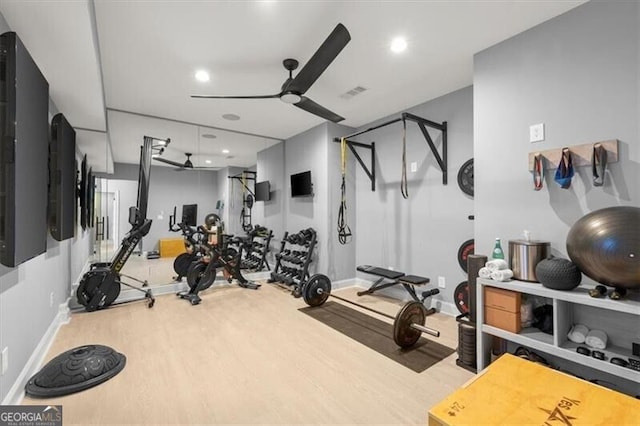 workout room with hardwood / wood-style flooring