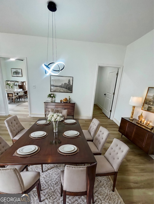 dining space featuring light hardwood / wood-style floors