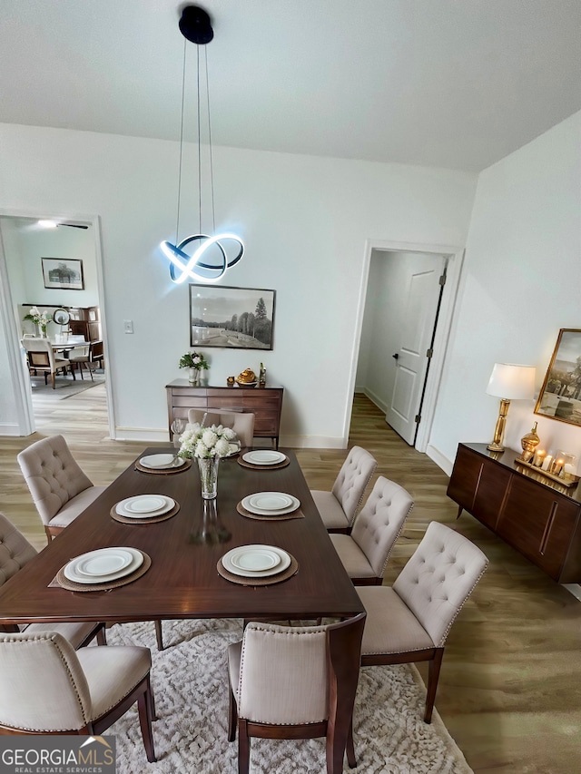 dining space featuring light hardwood / wood-style flooring