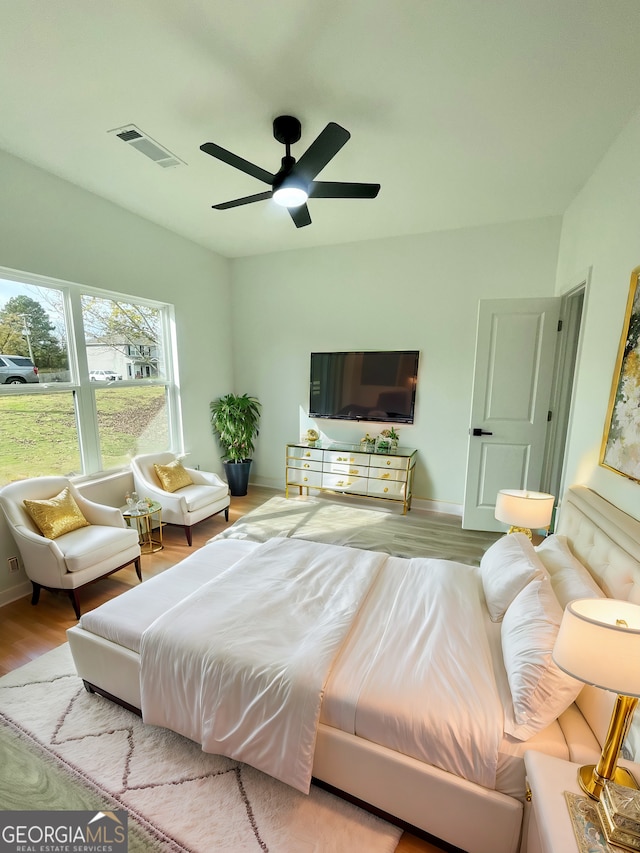 bedroom featuring hardwood / wood-style floors and ceiling fan