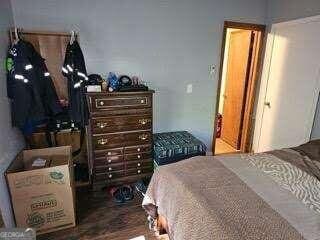 bedroom featuring wood-type flooring