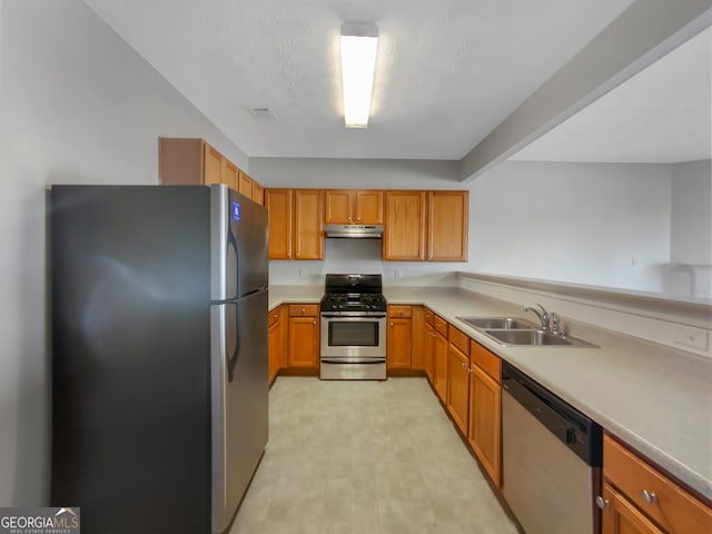 kitchen with appliances with stainless steel finishes and sink