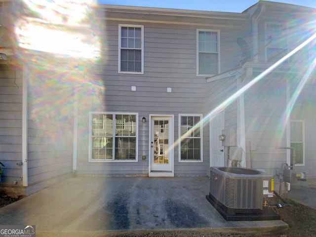 back of house featuring a patio and cooling unit