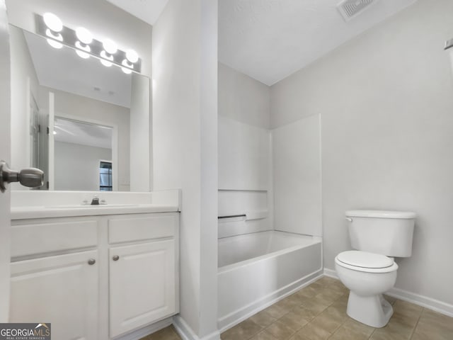 full bathroom featuring vanity, washtub / shower combination, toilet, and tile patterned flooring