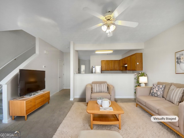 carpeted living room featuring ceiling fan