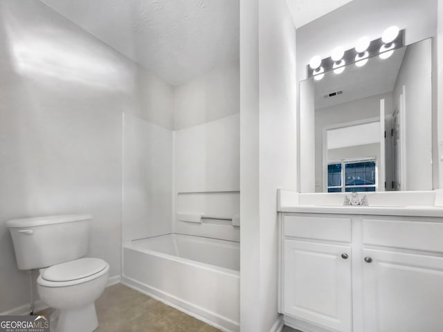 full bathroom with vanity, shower / tub combination, toilet, and tile patterned floors